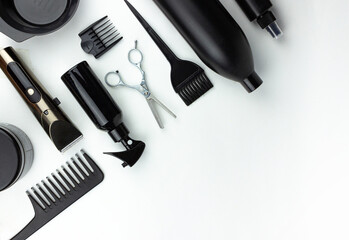 Set of hairdresser's tools on white background, hairdresser tools on white background top view. Barber tools, shears, clipper, razor, comb on a terry towel