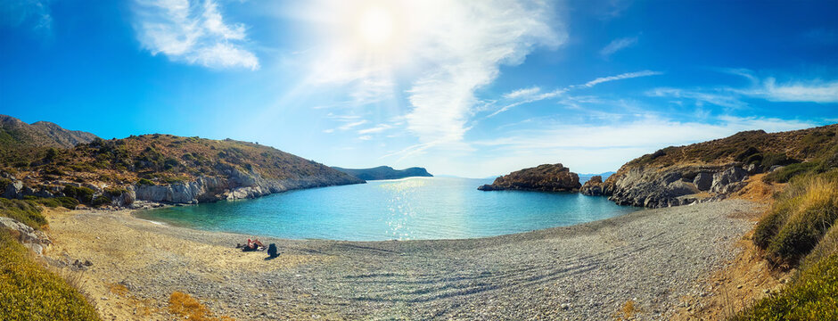 Men on deserted beach near ancient Greek city Knidos. Turkey. Panorama.