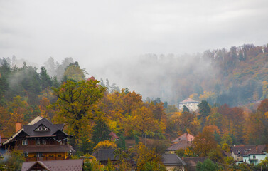 Fog over the village in the autumn morning