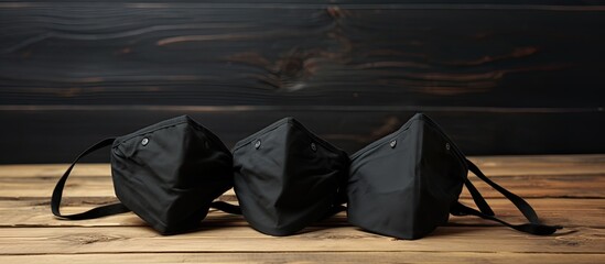 COVID 19 protection with homemade masks on a black and wooden background showcasing the healthiness against the virus