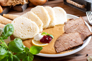 Svickova - Traditional czech dish: Marinated beef sirloin with creamy root vegetable sauce and...