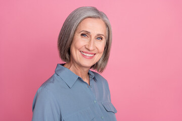 Photo of optimistic pensioner woman with bob hairstyle dressed blue stylish shirt toothy smiling on...