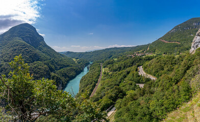 Fort l'&Eacute;cluse, France - 09 01 2021: View from the upper fort of the plain with greenhouses, Rhone river the Vuache mountain a bridge, a road and a railway track.