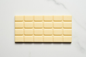 White chocolate bar on white marble background. 