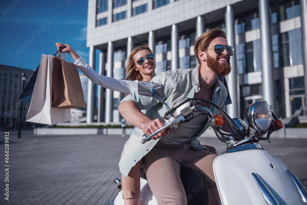 Poster couple on scooter