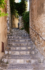 Fototapeta na wymiar Saint Paul de Vence (France), October 10, 2023. Typical street of the town. This is one of the most beautiful towns in France. Intellectuals and artists resided there. 