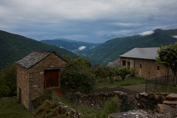Fototapeta na wymiar Rural landscape with stone houses in a stormy day. Asin de Broto, Huesca, Spain