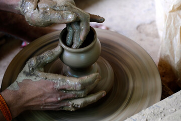 26 October 2023, Pune, India, Indian potter making Diya (oil lamps) or earthen lamps for Diwali...