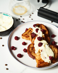 Coffee French toast. French toasts with coffee aroma and condensed milk serve with mascarpone cream and raspberries