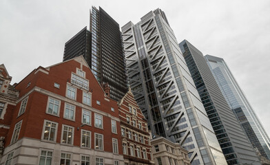 Skyscrapers and old eclectic buildings on Liverpool Street of London. Architectural View of Old and New Buildings in Contrasting Classical and Modern Designs, Old buildings with skyscrapers.