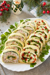 Creative appetizers christmas. Cheese rolls with crab sticks, cream cheese, eggs and cream cheese, sweet pepper, greens.