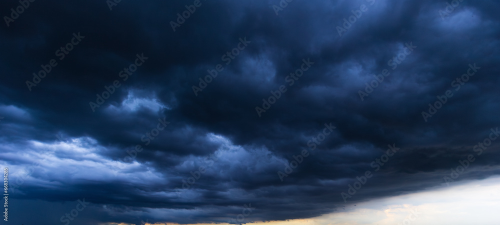 Poster bad or moody weather sky and environment. the dark sky with heavy clouds converging and a violent st