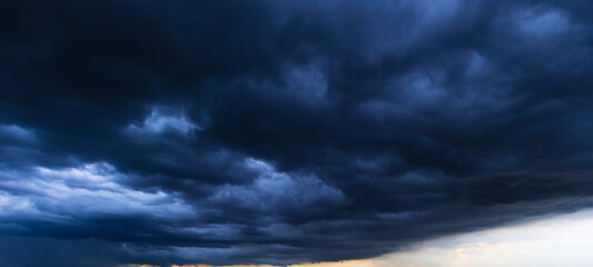 Bad or moody weather sky and environment. the dark sky with heavy clouds converging and a violent...