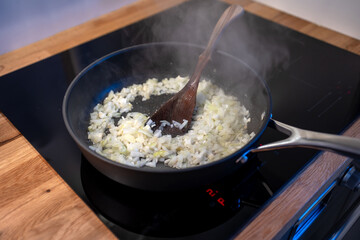 onions preparing on cooking pan