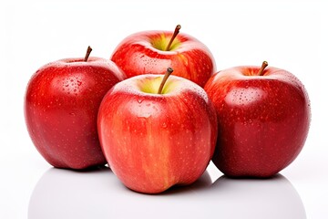 Three ripe red apples, a fresh and healthy fruit, against a white background in a studio shot.