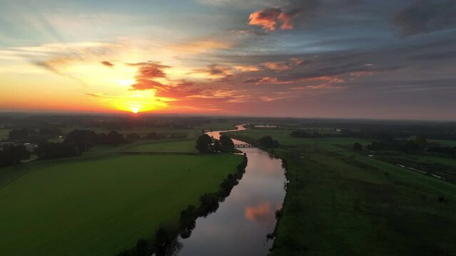 Sunrise over the Vecht river seen from above during a beautiful fall morning in Overijssel, The Netherlands.