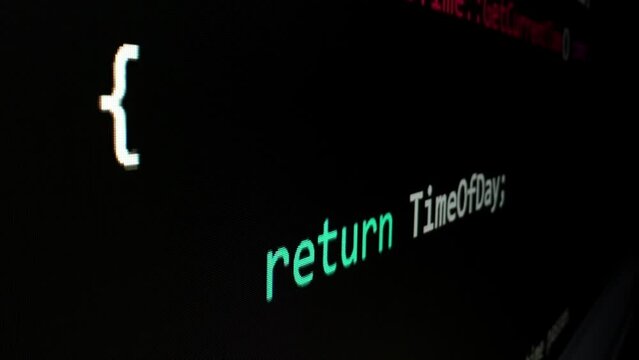 Closeup macro shot movement of coding script moving across LED screen with real-time AI-generated typing, showcasing advanced AI learning in optimization, debug and coding for software development.