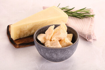 Chopped Italian hard parmesan cheese