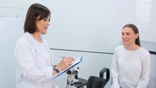 Photo of a gynecologist doctor and a patient on a gynecological chair. Preventive reception, preparation for medical examination, pregnancy management, health care gynecology contol.