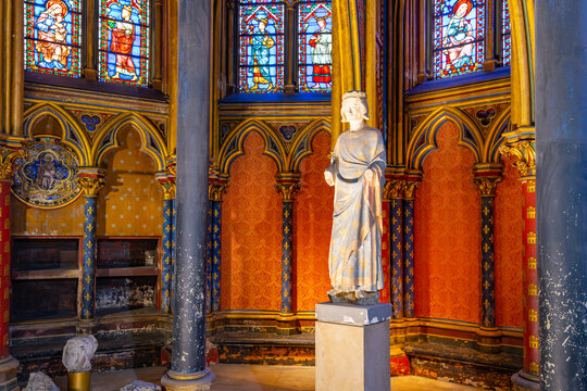 Lower chapel of Sainte-Chapelle with statue of Louis IX. Palais de la Cite, Paris, France
