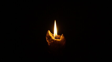 single candle with dark background