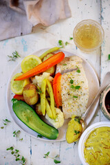 Poashed cod with vegetables and aioli .top veiw