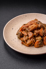 Delicious vegetable stew of potatoes, beef meat, mushrooms, carrots, salt, spices and herbs
