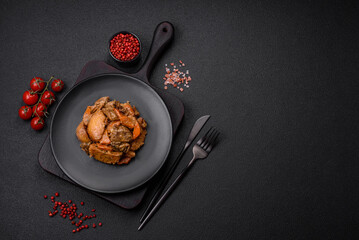 Delicious vegetable stew of potatoes, beef meat, mushrooms, carrots, salt, spices and herbs