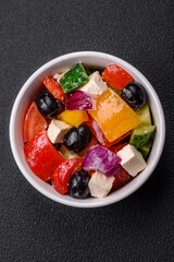 Delicious juicy Greek salad with feta cheese, olives, cucumber and tomatoes