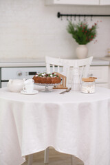 Christmas home interior in white kitchen Christmas chocolate bundt cake with fresh berries and rosemary. Winter baking. christmas trees. High quality photo