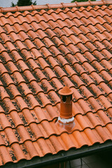 Weathered tiled roof of a house