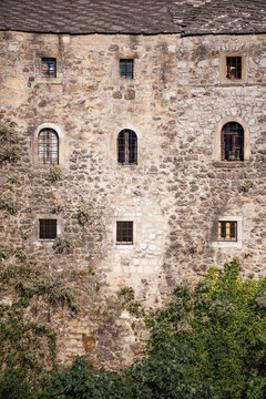 Building with stone walls and many windows