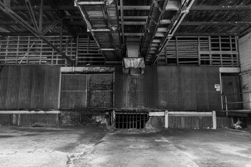 Black and white photo interior loading area of citrus distribution warehouse