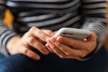 women's hands that confidently hold a smartphone, modern technology
