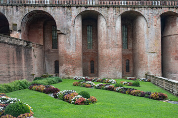Architecture of the red brick Sainte Cécile cathedral and its gardens in the town of Albi in France