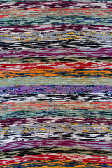 Detail of various woven fabric sewn into one canvas as background or texture. Closeup