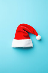 Santa claus hat on blue background. merry christmas concept.