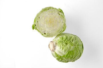 Fresh white cabbage halves isolated on white background. Top view with copy space
