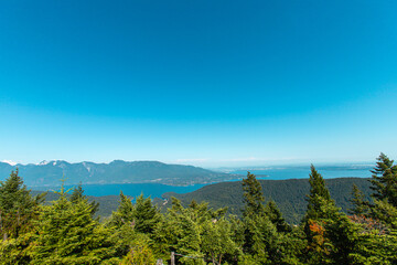 Beautiful view of the ocean and islands from the top of Mount Gardner, Bowen Island, British Columbia, Canada. Mt. Gardner is the highest point on Bowen Island.