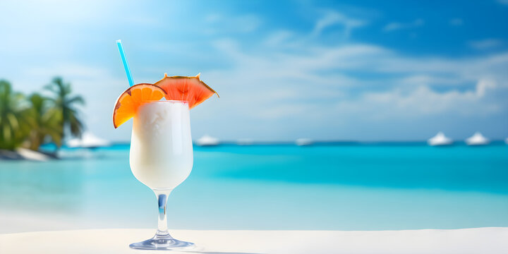 Glass with cocktail on the blue sea background, empty copyspace template