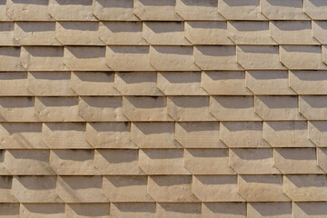 Brown texture of lamellar tiles on the roof.