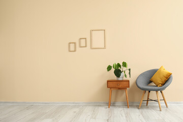 Interior of living room with armchair and table
