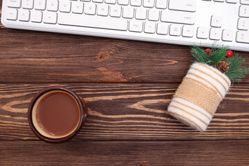 Laptop computer keyboard and Christmas and New Year decoration on wooden desktop
