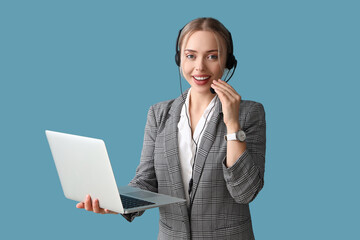 Female technical support agent with laptop on blue background