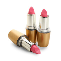 Beautiful pink lipsticks on white background