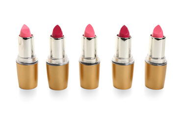 Different lipsticks on white background