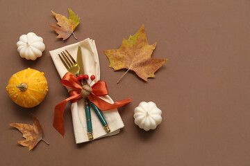 Autumn table setting on brown background