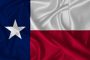 Flag of Texas blowing in the wind on fabric texture