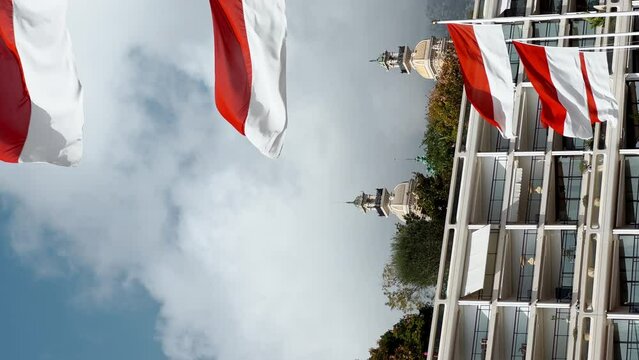 Flags of principality of Monaco in the wind at sunny weather