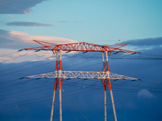 Hight voltage electric towers during sunset.